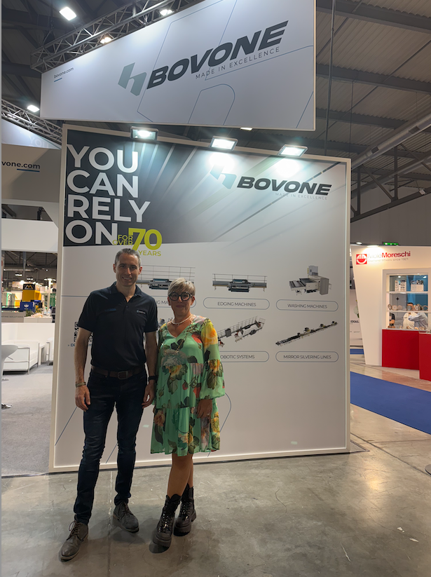 Pierre and Bovone rep standing in front of sign at marmomac